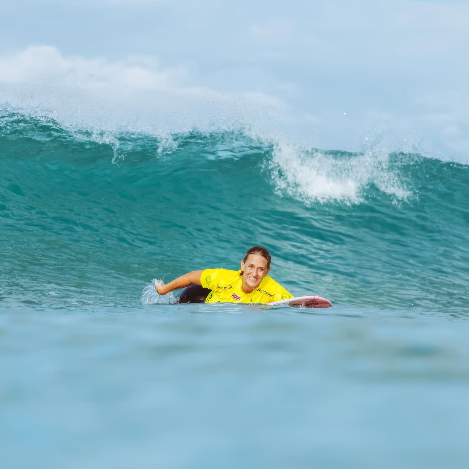 Maria do Sol paddling into a wave